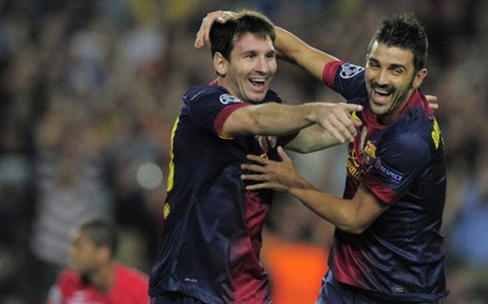 Lionel Messi and David Villa. Picture: AFP