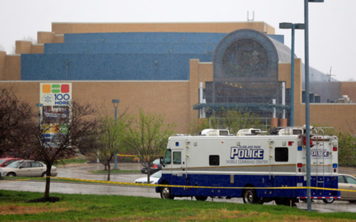 A police vehicle sits in front of the Jewish Community Center after three were killed when a gunman opened fire on 13 April, 2014 in Overland Park, Kansas. Picture: AFP.