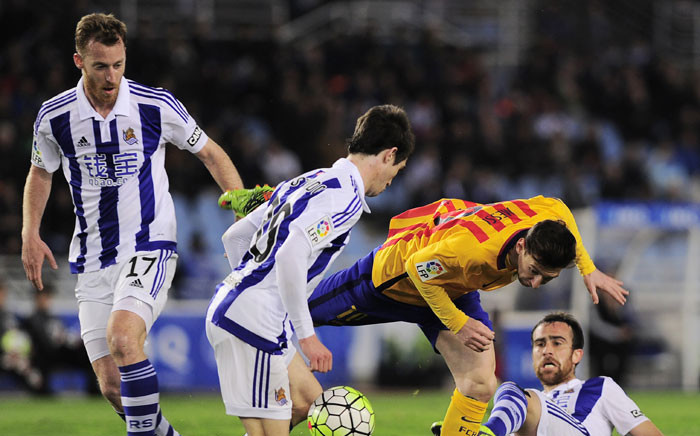 Barcelonas Argentinian forward Lionel Messi (2ndR) vies with Real Sociedad's defender Aritz Elustondo (2ndL), defender Mikel Gonzalez (R) and David Zurutuza during the Spanish league football match Real Sociedad vs FC Barcelona at the Anoeta stadium in San Sebastian on April 9, 2016. Picture: AFP/Ander Gillenea