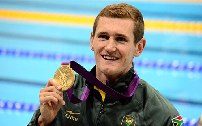 Golden Boy: Swimmer Cameron van der Burgh poses with his gold medal after winning the 100m breaststroke final, and setting a world record, at the London Olympics. Picture Wessel Oosthuizen/SA Sports Picture Agency