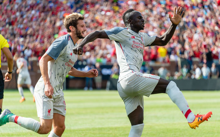 Liverpool's Adam Lallana and Sadio Mane celebrate a goal. Picture: AFP