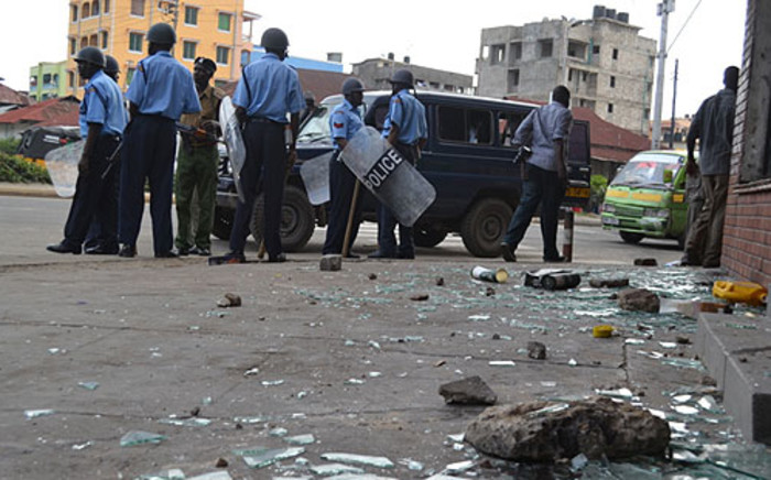Kenyan police patrol the port city of Mombasa after riots following the killing of a radical cleric. Picture: AFP