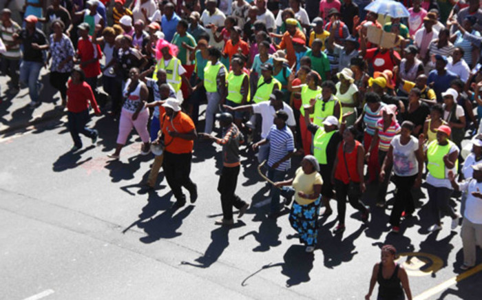 Scores of illegal protesters march through the street as they in Cape Town on 27 February 2014. Picture: Tertia van Rensburg/iWN.