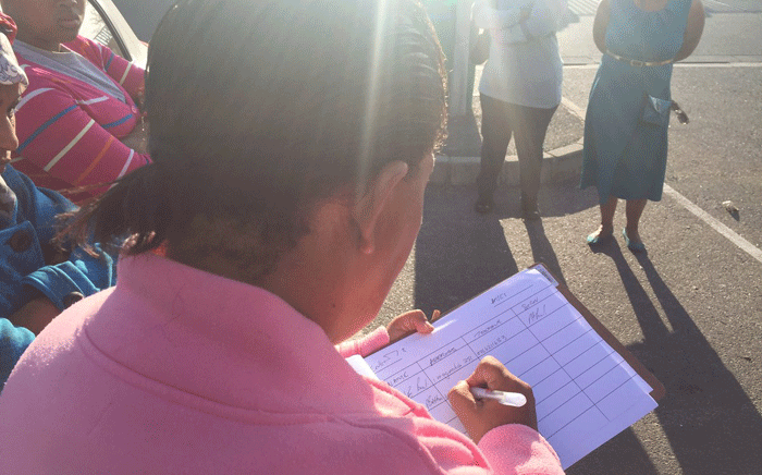 FILE: The grandmother of a raped Atlantis boy signing a petition opposing bail. Picture: Monique Mortlock/EWN.