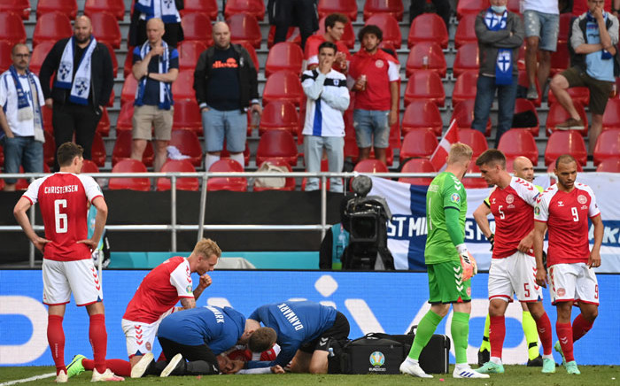Medics attend to Denmark's midfielder Christian Eriksen after he collapsed during the UEFA EURO 2020 Group B football match between Denmark and Finland at the Parken Stadium in Copenhagen on 12 June 2021. Picture: Jonathan Nackstrand/AFP