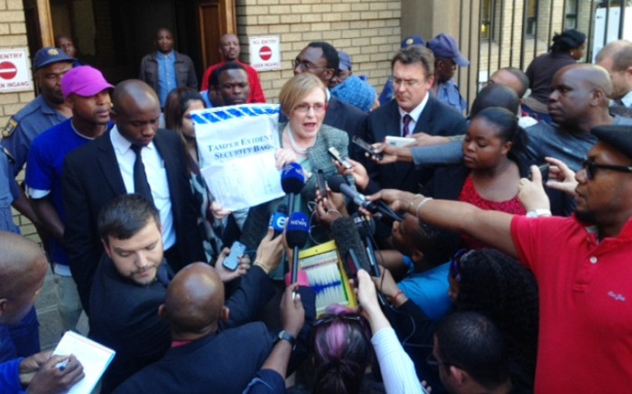 DA leader Helen Zille stands outside the North Gauteng High Court in Pretoria with the so-called Zuma spy tapes on 4 September 2014. Picture: Vumani Mkhize/EWN.
