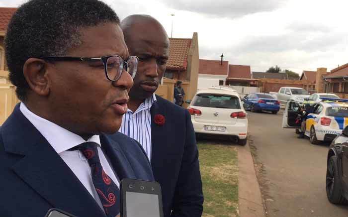 Police Minister Fikile Mbalula addressing the media in Vosloorus during his visit to the home of a policeman who was killed on duty. Picture: Katleho Sekhotho/EWN.