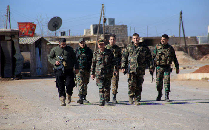FILE: Syrian government forces in the village of Tal Jabin, north of the embattled city of Aleppo, on 3 February 2016. Picture: AFP.