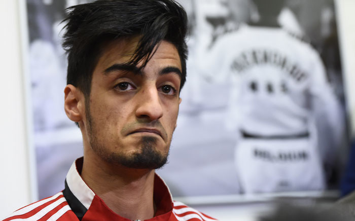 This file photo taken on 24 March 2016 shows Belgian Taekwondo athlete Mourad Laachraoui, younger brother of Brussels attacks suspect Najim Laachraoui, giving a press conference at the headquarters of the Francophone Belgian Taekwondo Association in Ukkel,Brussels. Picture: Emmanuel Dunand/AFP.
