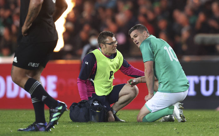 Johnny Sexton of Ireland receives medical attention for his injury during the rugby Test match between the New Zealand All Blacks and Ireland at Eden Park in Auckland on 2 July 2022. Picture: MICHAEL BRADLEY/AFP