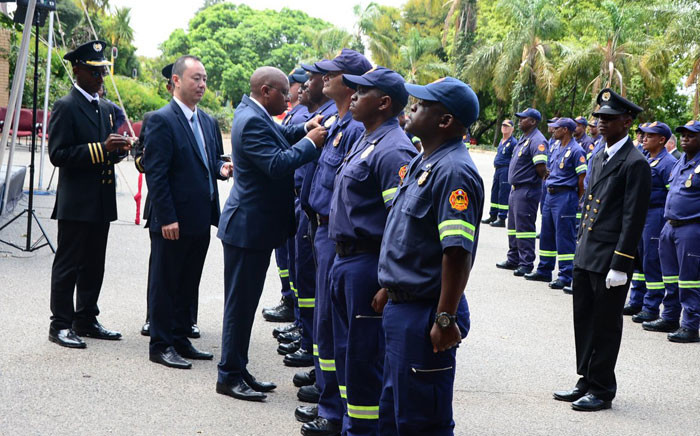City of Johannesburg Mayor Herman Mashaba hands out medals to the firefighters who battled a fire at the Lisbon Building in Johannesburg in 2018 on 28 January 2019. Picture: @CityofJoburgZA/Twitter
