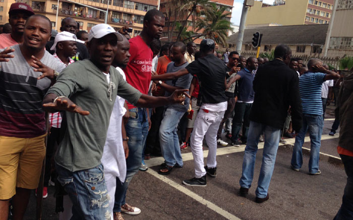 FILE: Police are trying to disperse a large crowd of around 2,000 people following a standoff between foreign shop owners and locals in Durban on 14 April 2015. Picture: Vumani Mkhize/EWN.