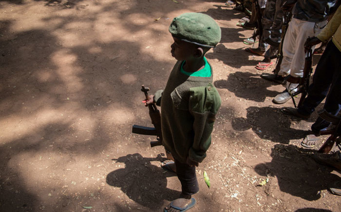 FILE: Newly released child soldiers stand with rifles during their release ceremony in Yambio, South Sudan, on 7 February, 2018. Picture: AFP