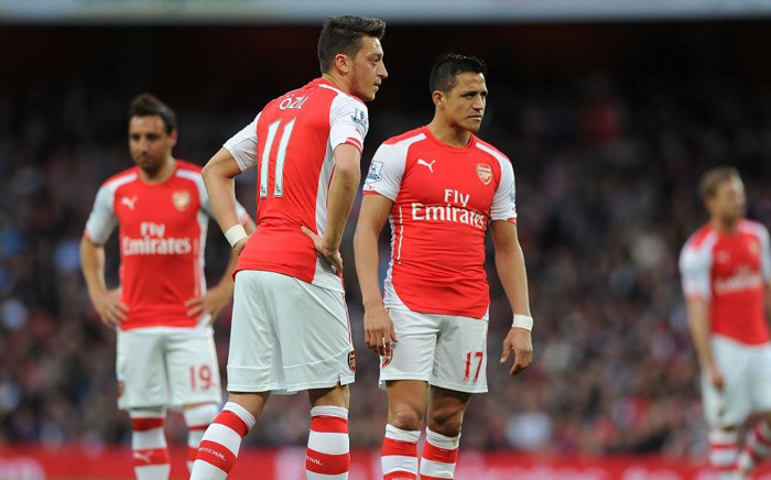 Alexis Sanchez and Mesut Ozil of Arsenal stare in despair after their loss to Swansea City in the English Premier League at the Emirates on 11 May 2015. Picture: Arsenal official Facebook page.