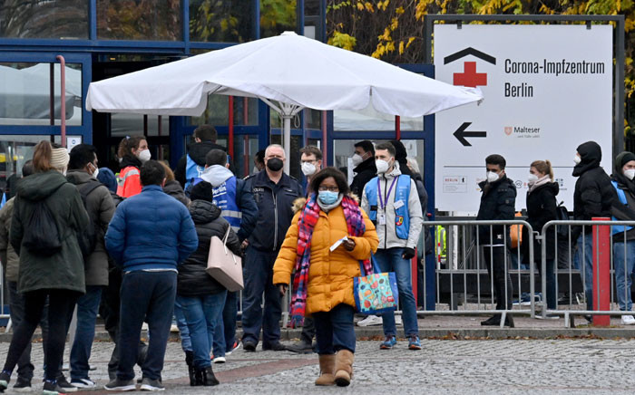 People queue up in front of the vaccination centre at the Messe Berlin fairgrounds on 24 November 2021 in Berlin, amid the ongoing novel coronavirus pandemic. Picture: John MACDOUGALL/AFP