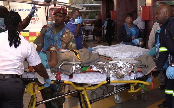 A victim of the Nigerian church collapse is stretchered into the Steve Biko Academic Hospital, Monday 22 September 2014, Picture: Vumani Mkhize/EWN.