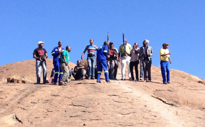 Miners gather on the koppie in Marikana ahead of the anniversary of the shooting in which 34 miners were killed. Picture: Christa van der Walt/EWN.