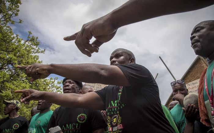 FILE: Amcu members outside the Brits magistrates court protest bail for the six murder accused appearing inside the court. Picture: Thomas Holder/EWN