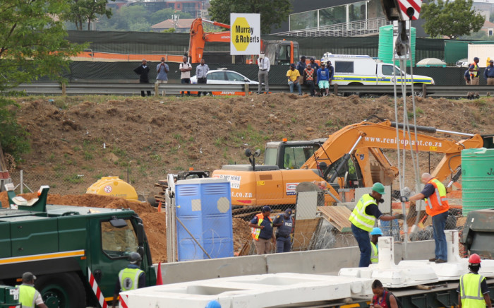 FILE: A Murray Roberts sign is seen at the scene where a temporary pedestrian bridge collapsed on the M1 in Sandton. Picture: Christa Eybers/EWN.