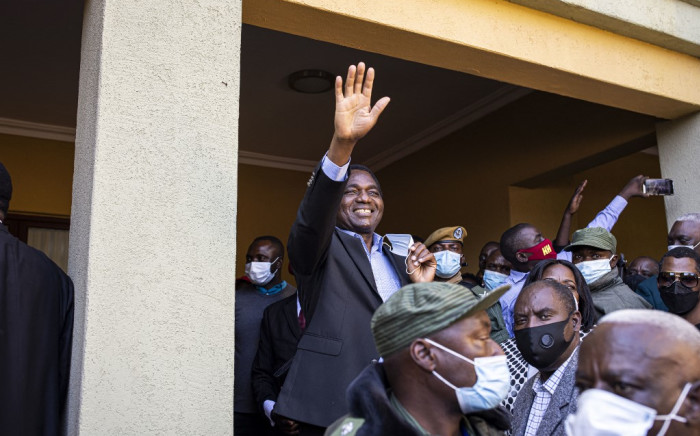 President-elect Hakainde Hichilema (C) waves at supporters after a press briefing at his residence in Lusaka, on 16 August 2021. Zambian business tycoon and veteran opposition leader Hakainde Hichilema scored a landslide victory in bitterly-contested presidential elections. Picture: Patrick Meinhardt/AFP