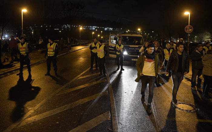 Police secures the area as supporters leave the stadium after the friendly football match Germany vs the Netherlands was called off for 'security reasons' in Barsinghausen on November 17, 2015. Picture: AFP.