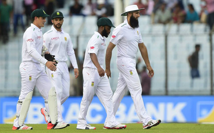 FILE: South African captain Hashim Amla (R) and cricketers Temba Bavuma (2R), Quinton de Kock (L) and Jean-Paul Duminy (2L) . Picture: AFP.