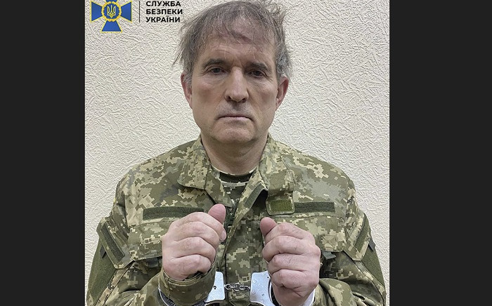 This undated and unlocated handout picture released on April 12, 2022 by the Security Service of Ukraine shows business tycoon Viktor Medvedchuk with his hands in cuffs and dressed in a Ukrainian army uniform. Ukrainian authorities announced on April 12, 2022 they had captured Medvedchuk a prominent pro-Kremlin tycoon who escaped from house arrest after Russia's invasion. Picture: Handout / Security Service of Ukraine / AFP