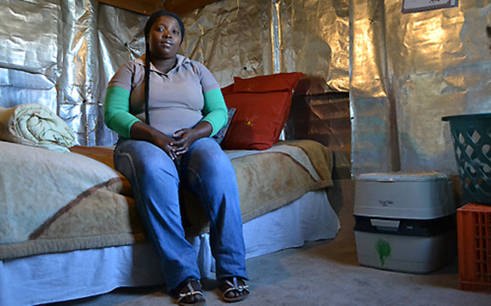 Sisanda Mntakaziwa sits in her home in the Cape Town informal settlement Jan se Bos, which received portable flush toilets from the City of Cape Town, on 6 June 2013. Picture: Aletta Gardner/EWN