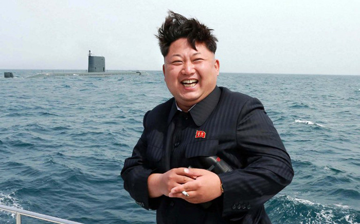 FILE: This undated picture released from North Korea's official Korean Central News Agency (KCNA) on 9 May 2015 shows North Korean leader Kim Jong-Un smiling while observing an underwater test-fire of a submarine-launched ballistic missile at an undisclosed location at sea. Picture: AFP.