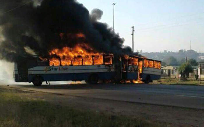 A bus was set alight and roads blocked in Hammanskraal following service delivery protests in the area. There were also reports of overnight violent demonstrations on 23 May 2016. Picture: Arrive Alive.