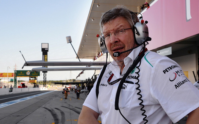 FILE: Mercedes team principal Ross Brawn of Britain walks in the pit lane prior to the second free practice session ahead of the Formula One Japanese Grand Prix in Suzuka on October 11, 2013. Picture: AFP.