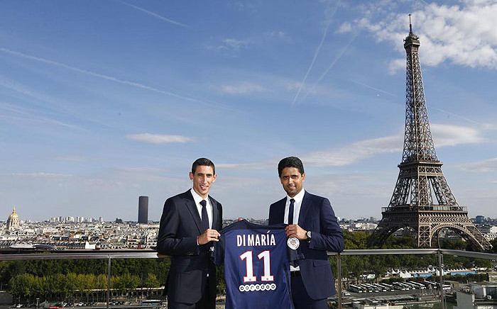 Angel Di Maria stands with Paris St. Germain President Nasser Al-Khelaifi after signing for the French club in August 2015. Picture: PSG/Twitter