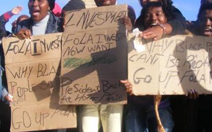 Protesters highlight the ongoing cases on mob justice in Khayelitsha outside the court. Picture: EWN