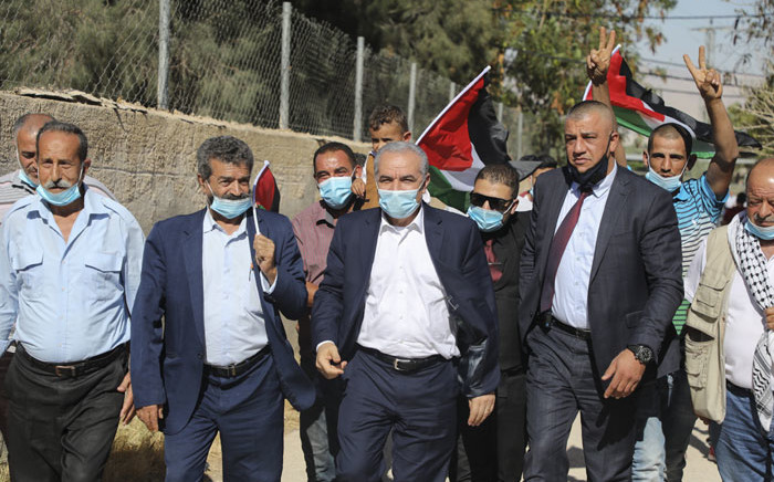 Palestinian Prime Minister Muhammad Shtayyeh (C), clad in mask due to the COVID-19 coronavirus pandemic, leaves following a meeting with members of his government and officials of the Palestine Liberation Organisation (PLO) in the Jordan Valley village of Fasayil in the occupied West Bank on 24 June 2020, to discuss Israel's West Bank annexation plans. Picture: AFP