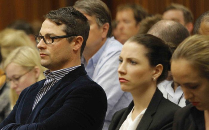 Carl and Aimee Pistorius watch court proceedings at the High Court in Pretoria on 4 March 2014. Picture: Pool.