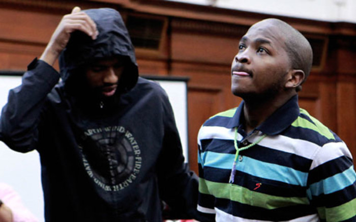 Xolile Mngeni (L) and Mziwamadoda Qwabe (R), accused in the murder of honeymooner Anni Dewani, appear in the Western Cape High Court in Cape Town on Friday, 10 February 2012. Picture: Nardus Engelbrecht/SAPA