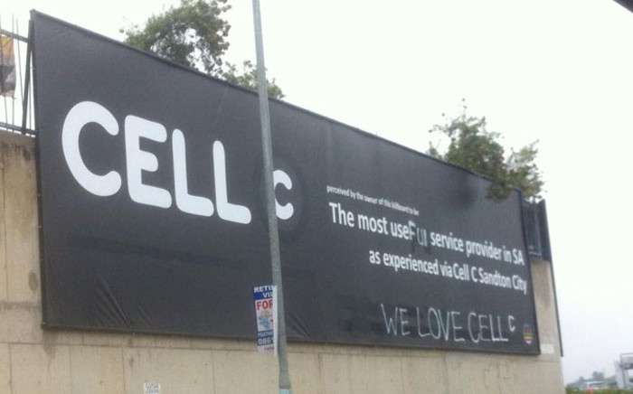 A billboard labelling Cell C as the worst cellphone provider in SA has been vandalised, now saying, 'We love Cell C’. Picture: @ThisJustinGuy via Twitter