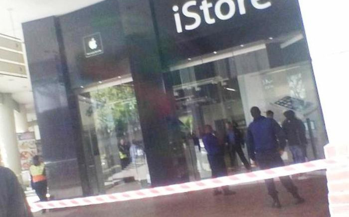 Police cordon off the scene of the iStore robbery at Centution Mall on 22 August, 2014. Picture: Twitter via @kelstamza.