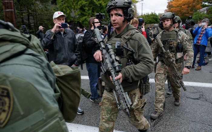 Rapid reaction SWAT members leave the scene of a mass shooting at the Tree of Life Synagogue in the Squirrel Hill neighbourhood on 27 October 2018 in Pittsburgh, Pennsylvania. Picture: AFP.