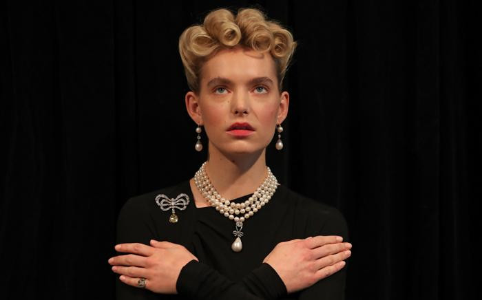 A model wears jewellery that once belonged to Marie Antoinette, including a pearl and diamond necklace, a diamond brooch, a pair of pearl and diamond pendant earrings and a diamond and woven hair ring, during a photocall for the sale of 'Royal Jewels from the Bourbon Parma Family' at Sotheby's auction house in London on 19 October 2018. Picture: AFP.