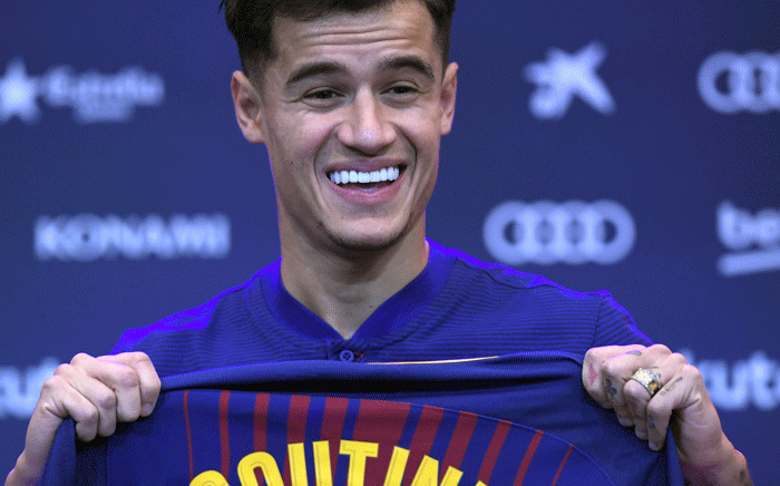 FILE: Barcelona's new Brazilian midfielder Philippe Coutinho shows his new jersey before holding a press conference in Barcelona on 8 January 2018. Picture: AFP