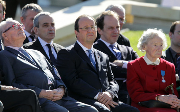 French President Francois Hollande sits during a French D-Day commemoration ceremony at the World War II memorial in Caen, Normandy, on 6 June 2014, marking the 70th anniversary of the World War II Allied landings in Normandy. Picture: AFP.