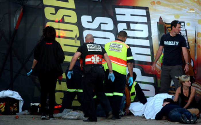 Emergency workers attend to a scene where twenty people were injured at a rock concert at the Cape Town Stadium on Wednesday evening, 7 November 2012 when a temporary scaffolding structure collapsed due to strong winds. American rockers Linkin Park were performing at the stadium. Picture: Nardus Engelbrecht/SAPA