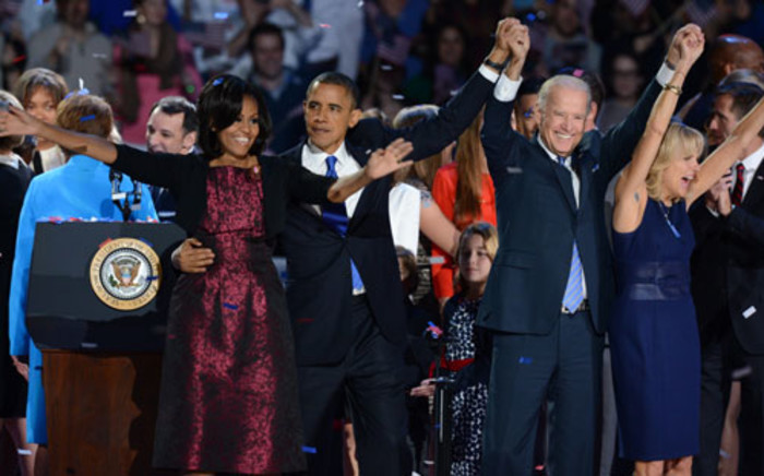 (L-R) US First Lady Michelle Obama, US President Barack Obama, US Vice President Joe Biden and his wife Jill Biden celebrate on election night November 7, 2012 in Chicago, Illinois. Picture: AFP.