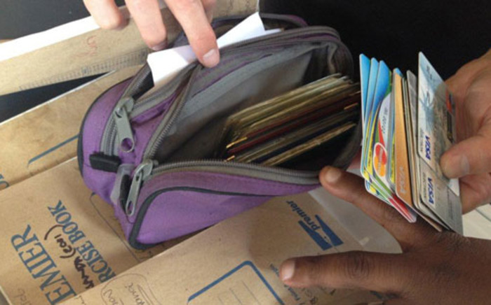 A Cape Town woman is in hot water with the National Credit Regulator after she was found in possession of bank cards. 
