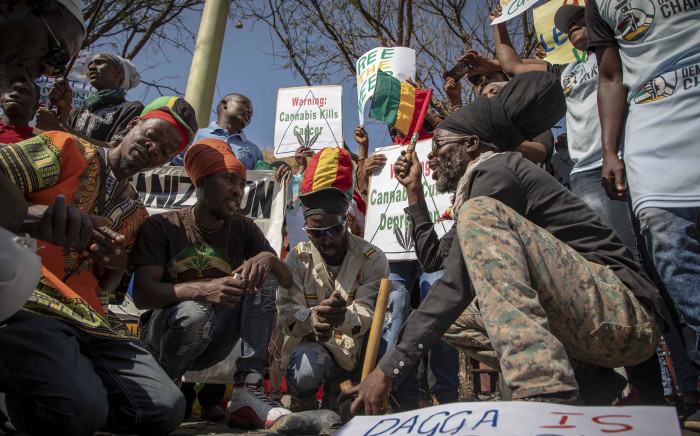 Rastafarians smoke cannabis outside the South African Constitutional Court on 18 September 2018 before the ruling on the private use marijuana is delivered. Picture: Thomas Holder/EWN