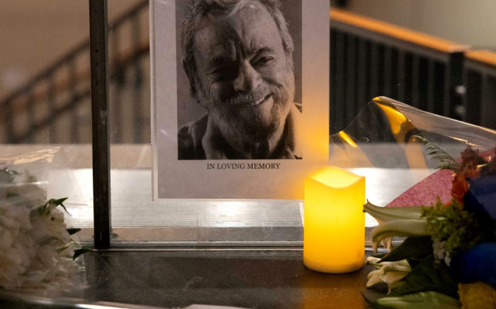A picture of late US composer Stephen Sondheim is displayed among flowers outside Stephen Sondheim Theatre in New York City on November 26, 2021. Picture: Yuki IWAMURA / AFP 