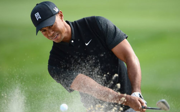 Tiger Woods of USA plays a bunker shot on the 11th hole during the third round of the Honda Classic on March 2, 2013 in Palm Beach Gardens, Florida. Picture: Stuart Franklin/Getty Images/AFP