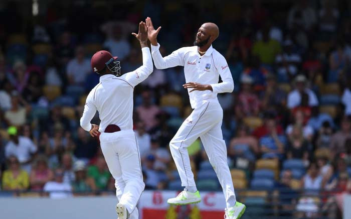 West Indies Roston Chase and teammate celebrate a wicket during their clash with England. Picture: @windiescricket/Twitter.