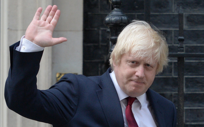 FILE: Boris Johnson waves as he leaves 10 Downing Street in central London after British Prime Minister Theresa May took office. Picture: AFP.